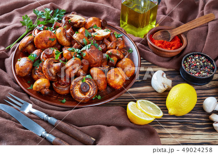 close up of spicy lightly fried champignons 49024258
