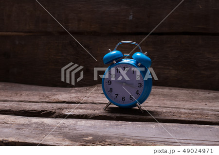 Blue alarm clock. 49024971