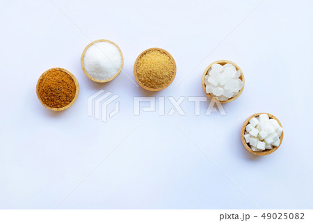 Various types of sugar on white. Various types of sugar on white. 49025082