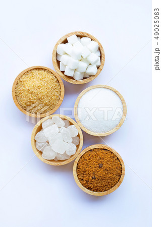 Various types of sugar on white. Various types of sugar on white. 49025083