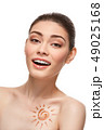 girl with sun drawing on forehead is 49025168