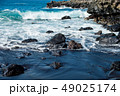 beautiful view on ocean water and black lava sand 49025174