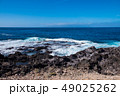 beautiful view on ocean water and black lava sand 49025262