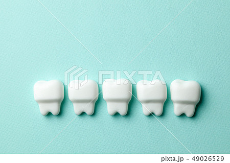 Healthy white teeth on green mint background Healthy white teeth on green mint background 49026529