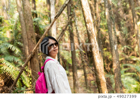 traveling woman walk in forest 49027399
