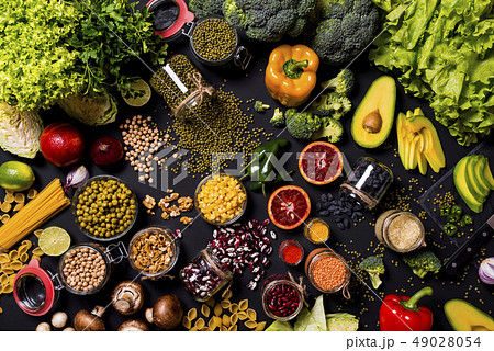 Big set of fresh vegetables and fruits on black background. Different colorful fresh vegan food 49028054