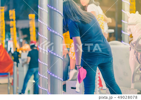 People take a photo  on the children's carousel 49028078
