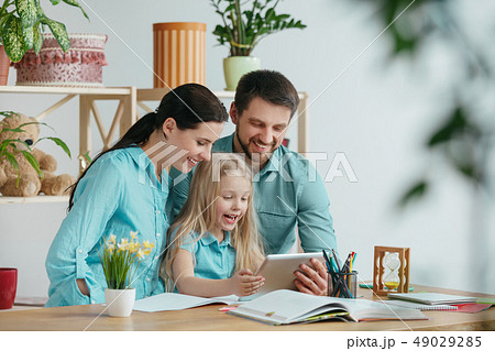 Young happy family are spending time together. A day with loved ones at home. 49029285