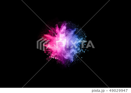 Abstract colored dust explosion on a black backgro Abstract colored dust explosion on a black backgro 49029947