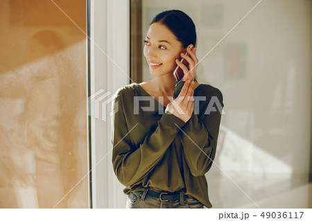 elegant girl in a green blouse elegant girl in a green blouse 49036117
