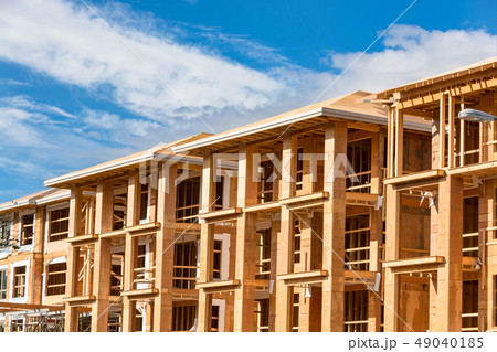 Apartment building under construction on sunny day on blue sky background 49040185