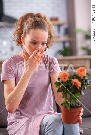 Unhappy good-looking young woman being upset with her skin 49041341