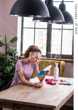 Curly-haired skinny woman having allergic reaction on her hands Curly-haired skinny woman having allergic reaction on her hands 49041461