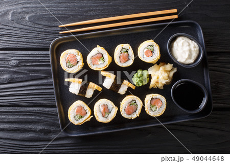 Tamagoyaki sushi roll with rice, cheese, salmon 49044648