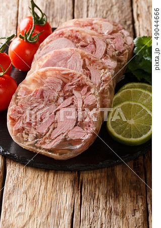 Fresh sliced brawn served with tomatoes, lime 49044666