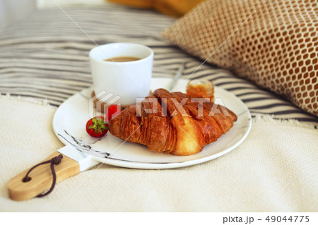 Breakfast with croissant, coffee, strawberry and Breakfast with croissant, coffee, strawberry and 49044775