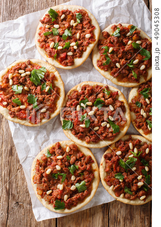 Arab mini pizza with minced meat, tomatoes 49045308