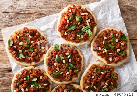 Arab mini pizza with minced meat, tomatoes 49045311