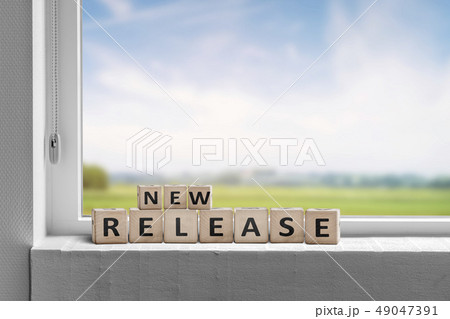 New release sign in a window on a sill New release sign in a window on a sill 49047391