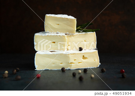 Cheese camembert or brie with fresh rosemary Cheese camembert or brie with fresh rosemary 49051934
