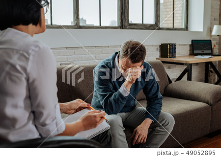 Despaired short-haired patient having mental issues and explaining them Despaired short-haired patient having mental issues and explaining them 49052895