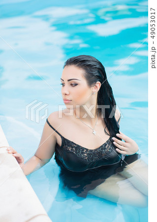 Portrait of a young adorable brunette. Portrait of a young adorable brunette. 49053017