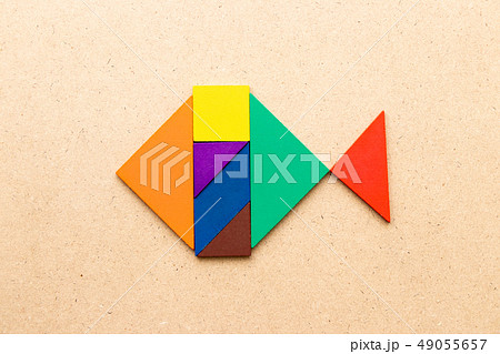 Color tangram puzzle in swimming fish shape Color tangram puzzle in swimming fish shape 49055657
