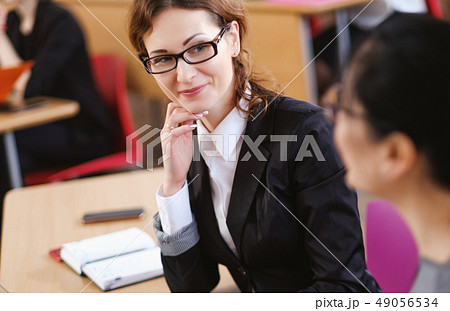 Multinational group of students in an auditorium Multinational group of students in an auditorium 49056534