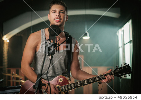 Music band having rehearsal in a studio Music band having rehearsal in a studio 49056954