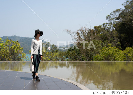 traveling woman walk at Xiangshan Visitor Center 49057585