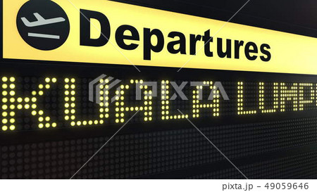 Flight to Kuala Lumpur on international airport departures board. Travelling to Malaysia conceptual 49059646