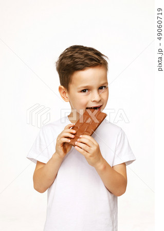 little beautiful boy holding chocolate studio shot little beautiful boy holding chocolate studio shot 49060719