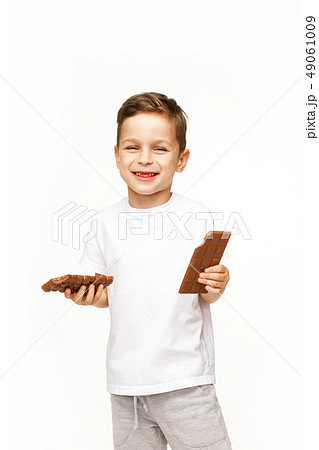 little beautiful boy holding chocolates studio shot little beautiful boy holding chocolates studio shot 49061009