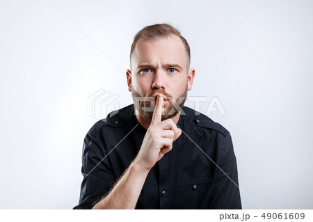 Portrait of stylish man with beard show sign silence 49061609
