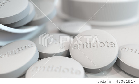 Close-up shot of pills with stamped ANTIDOTE text on them. 3D rendering Close-up shot of pills with stamped ANTIDOTE text on them. 3D rendering 49061917