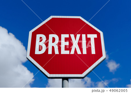 Red Stop Sign with text Brexit against blue sky Red Stop Sign with text Brexit against blue sky 49062005