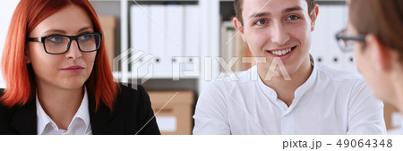 Smiling man in shirt shake hands hello in office Smiling man in shirt shake hands hello in office 49064348