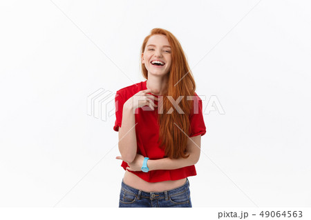 Good-looking female with sincere smile rejoicing her success having good mood showing her positive 49064563