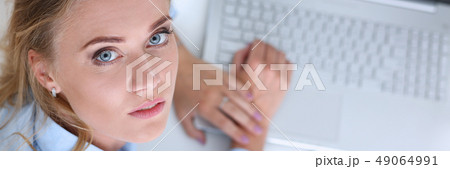 Beautiful smiling businesswoman portrait at workplace Beautiful smiling businesswoman portrait at workplace 49064991