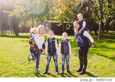 Theme family active leisure outside in nature. large Caucasian family with four children. Mom and 49065310