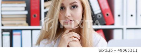 Beautiful smiling businesswoman portrait at workplace Beautiful smiling businesswoman portrait at workplace 49065311