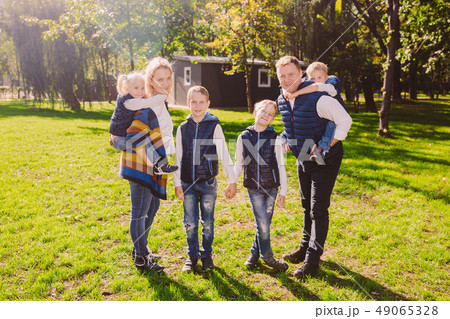 Theme family active leisure outside in nature. large Caucasian family with four children. Mom and 49065328