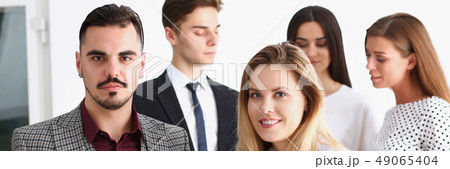 Group of smiling people stand in office Group of smiling people stand in office 49065404
