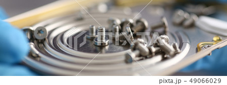 Small bolts removed macro in repair shop to restore 49066029