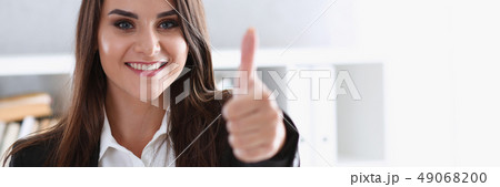 Beautiful smiling woman showing ok or approval Beautiful smiling woman showing ok or approval 49068200