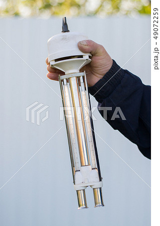 hand holds the measuring device for weather  49072259