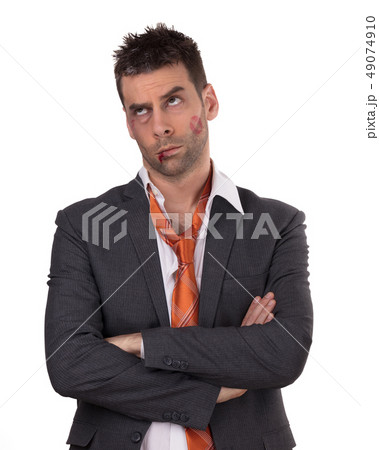 Close up of a businessman with bloody lip, beaten Close up of a businessman with bloody lip, beaten 49074910