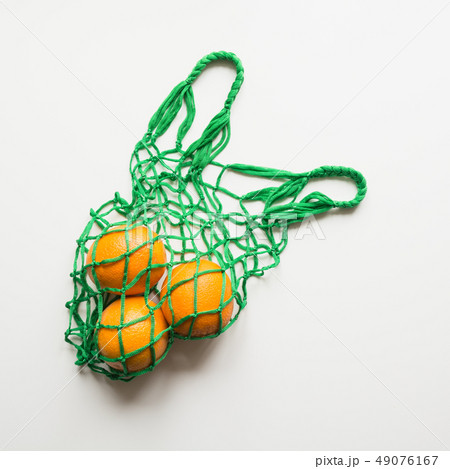 Shopping bag with orange. Zero waste concept. 49076167