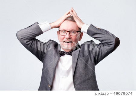 Man with shocked, amazed expression  49079074