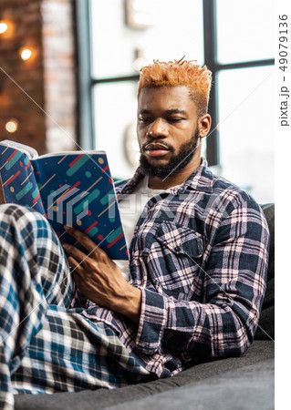 Nice smart man getting new knowledge from the book 49079136